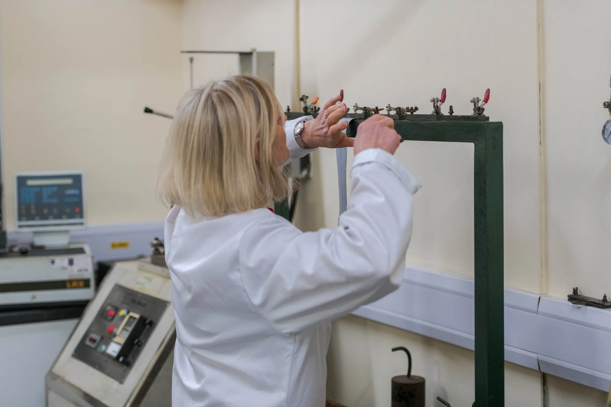 woman using equipment in warehouse