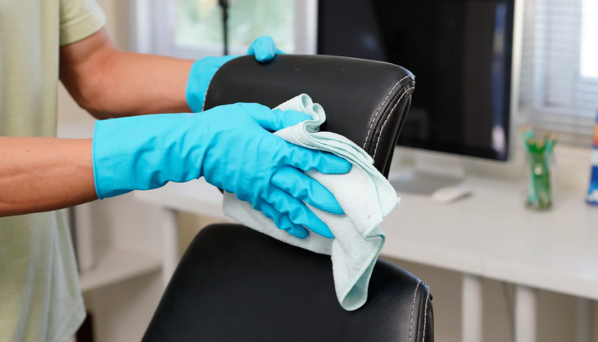 Wiping down upholstery fabric with cloth